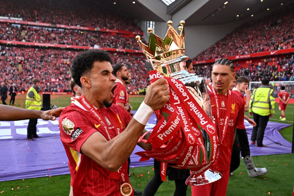 Luis Diaz celebrates with the Premier League trophy as Liverpool are crowned champions.