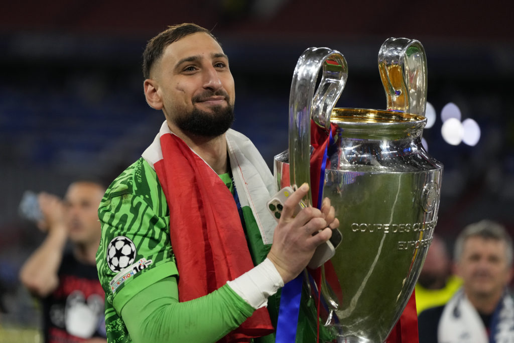 Gianluigi Donnarumma lifts the Champions League trophy with PSG.