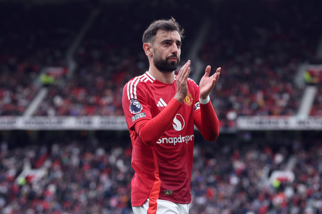 Bruno Fernandes applauds the fans during game against Aston VIlla.