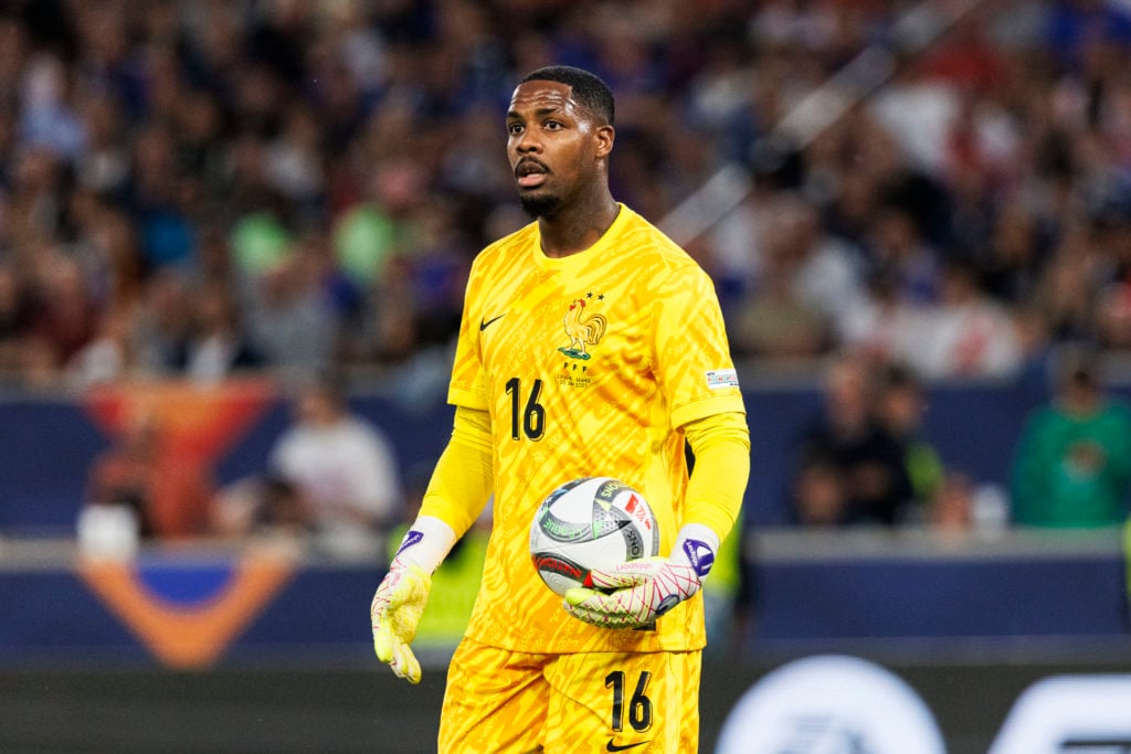 Mike Maignan in action for France vs Spain.