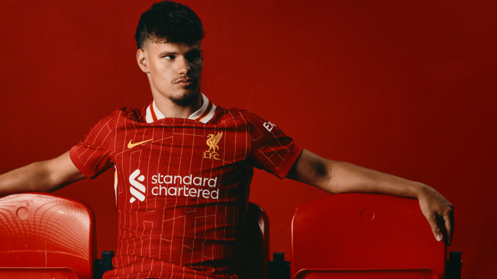 Milos Kerkez poses during his Liverpool unveiling.