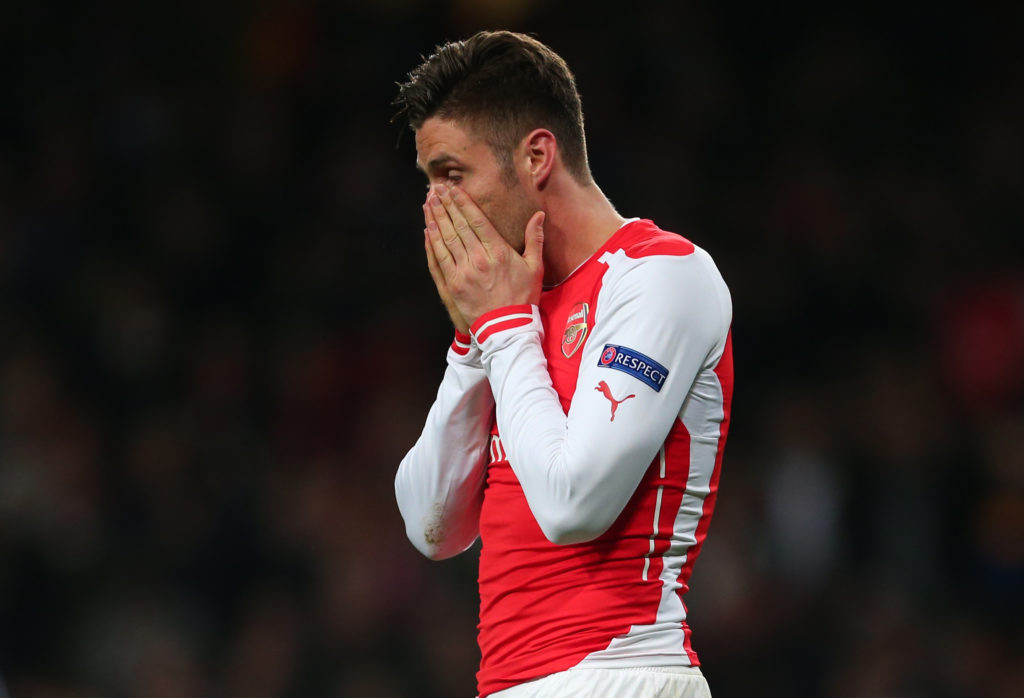 Olivier Giroud holds his head in his hands after missing a chance for Arsenal in their 2015 Champions League tie with Monaco.