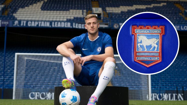 Liam Delap poses after signing for Chelsea, Ipswich Town badge inset