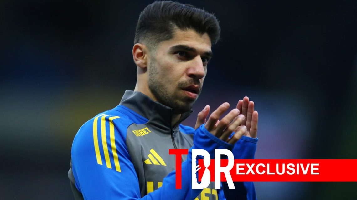 Image of Manor Solomon applauding the fans during a Leeds United game, overlaid a TBR exclusive banner