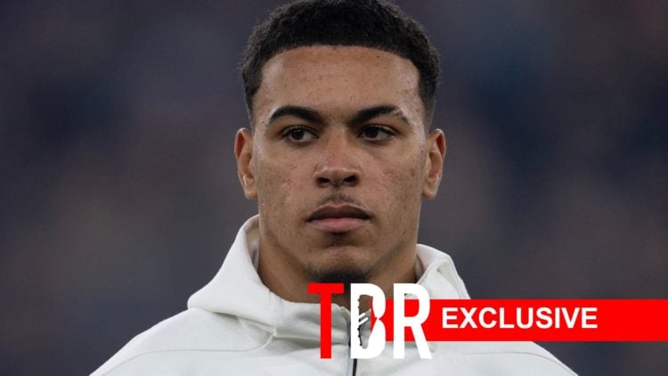 Image of Morgan Rogers looking on before an Aston Villa game, overlaid a TBR exclusive banner