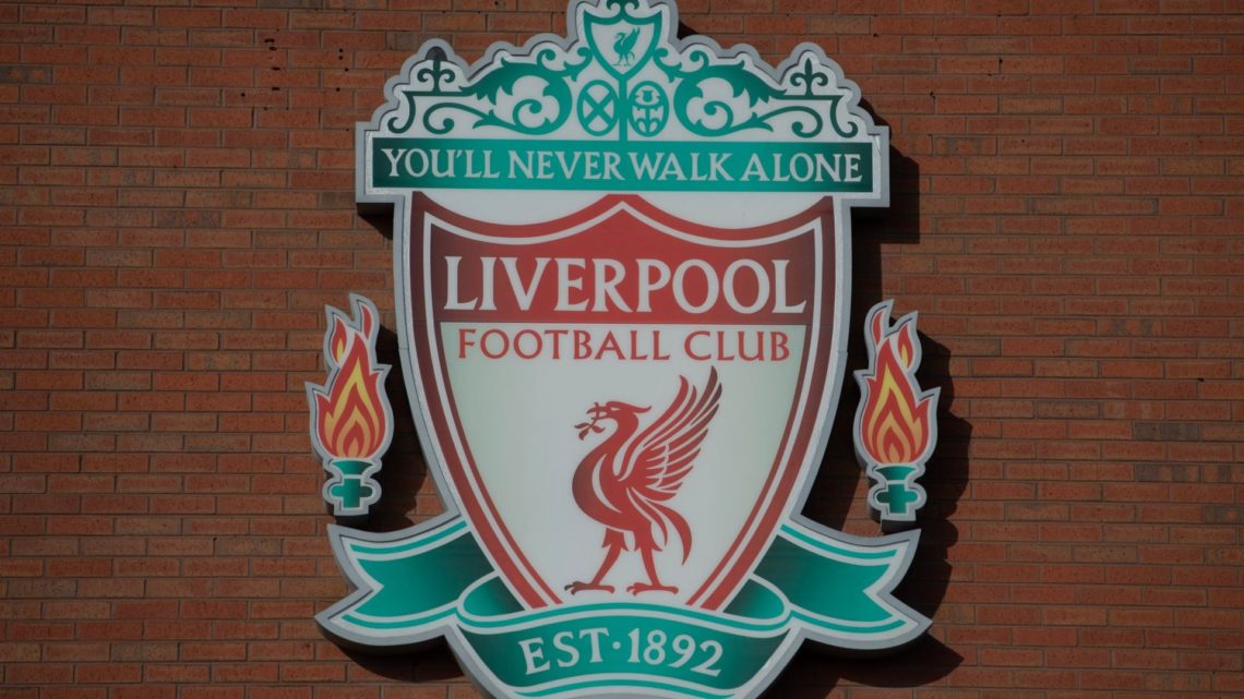 Image of the Liverpool badge outside Anfield stadium