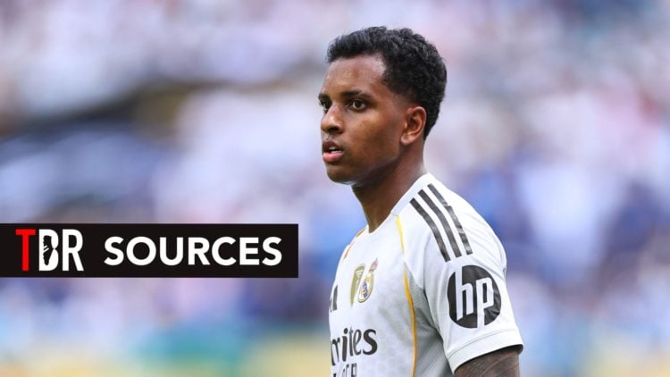 Real Madrid forward Rodrygo looks on.