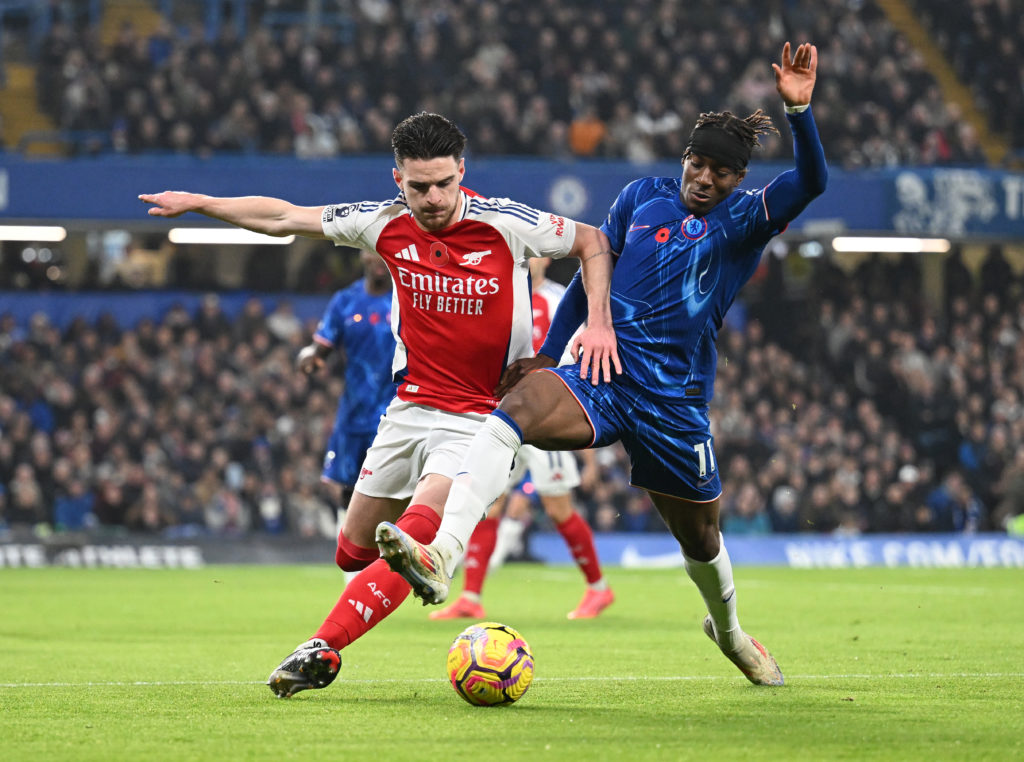 Arsenal's Declan Rice duels with Chelsea's Noni Madueke.