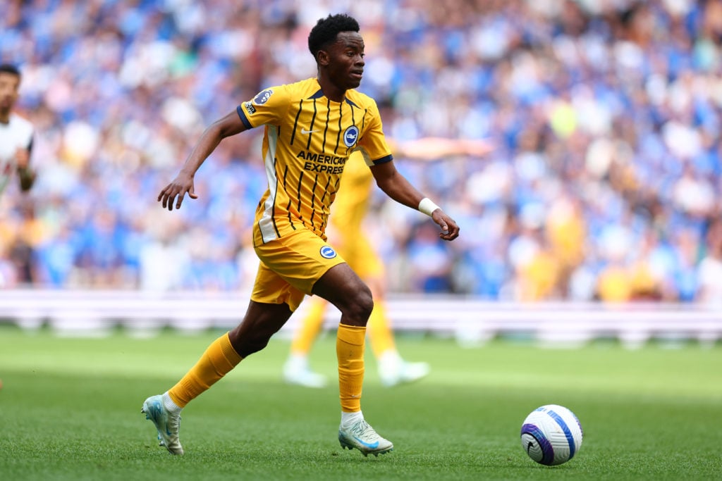 Simon Adingra dribbles with the ball for Brighton.
