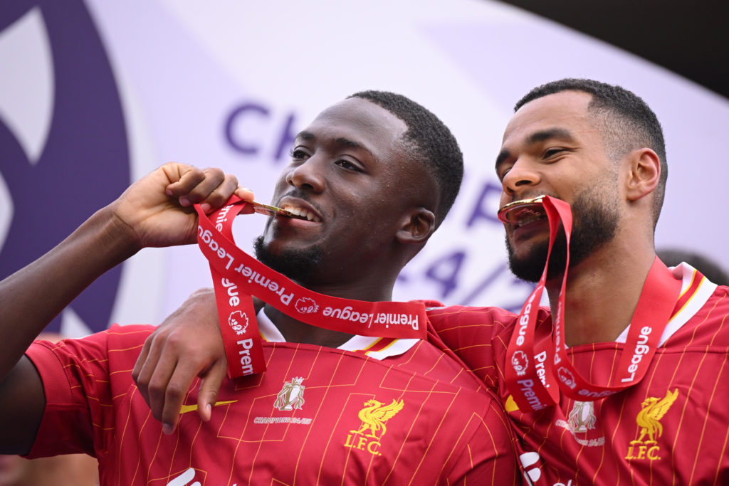Ibrahima Konate posing with the Premier League winners medal