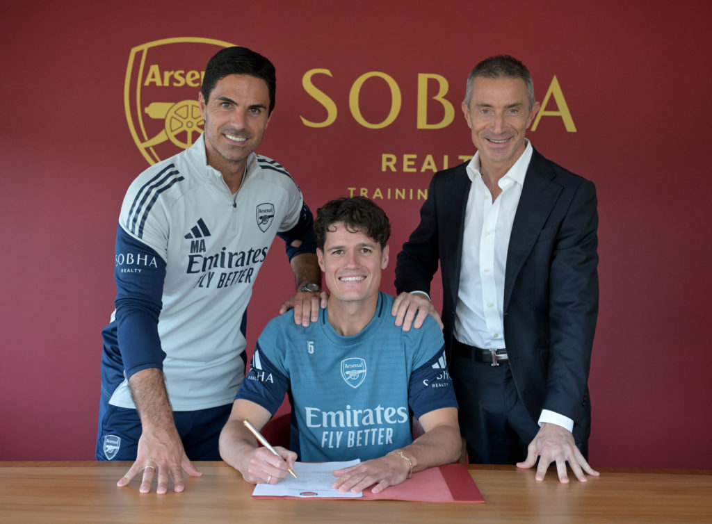 Christian Norgaard signing his contract at Arsenal alongside Mikel Arteta and Andrea Berta