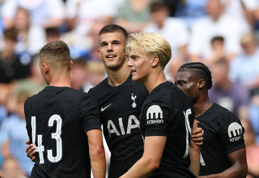 Tottenham players celebrate after scoring against Reading in a friendly