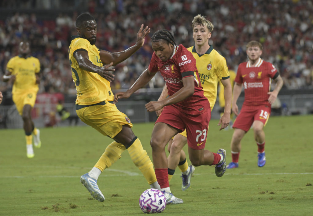Fikayo Tomori of AC Milan competes for the ball with Rio Ngumoha of Liverpool FC during the Pre-Season Friendly match between Liverpool FC an AC Milan at Kai Tak Sports Park on July 26, 2025