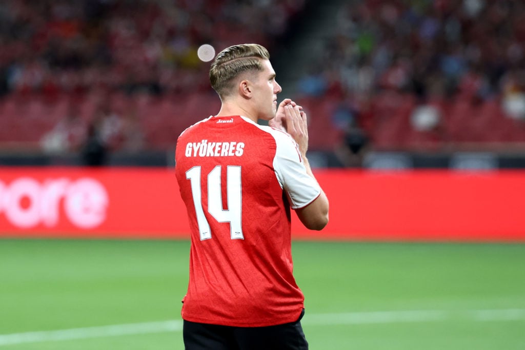 Viktor Gyokeres of Arsenal, seen wearing the number 14 shirt, walks out onto the pitch following his recent transfer from Sporting CP prior to the Pre-Season Friendly between Arsenal FC and Newcastle United at The Singapore National Stadium on July 27.