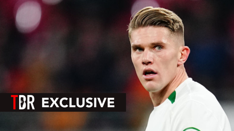 Image of Arsenal target Viktor Gyokeres looking on during a Sporting CP game, overlaid a TBR Exclusive banner