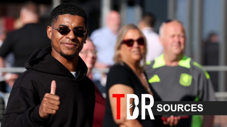 Marcus Rashford with a thumbs up and smiling down the camera