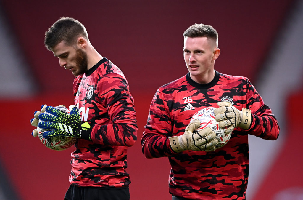 Dean Henderson of Manchester United warms up with team mate David De Gea ahead of The Emirates FA Cup Fourth Round match against Liverpool.