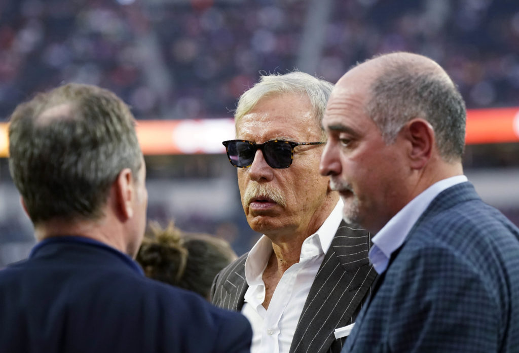Arsenal owner Stan Kroenke speaks with colleagues before pre-season friendly