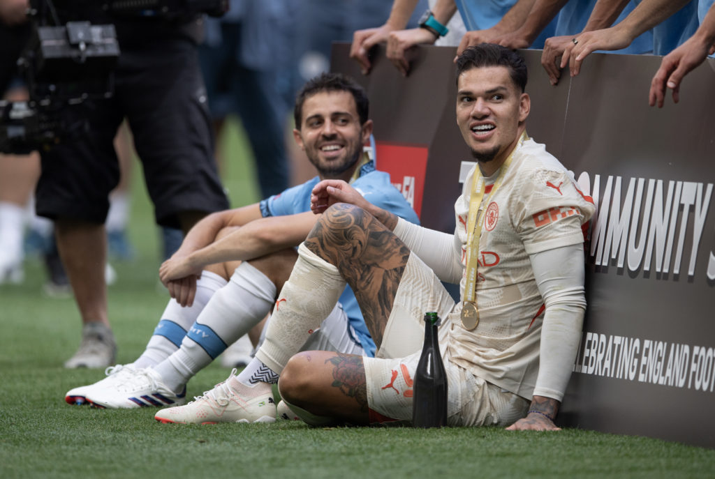 Bernardo Silva and goalkeeper Ederson of Manchester City after the 2024 FA Community Shield match between Manchester United and Manchester City at Wembley Stadium