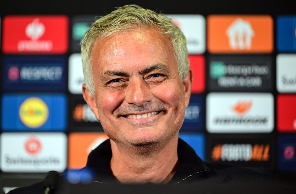 Jose Mourinho smiles and looks on as Man Utd boss