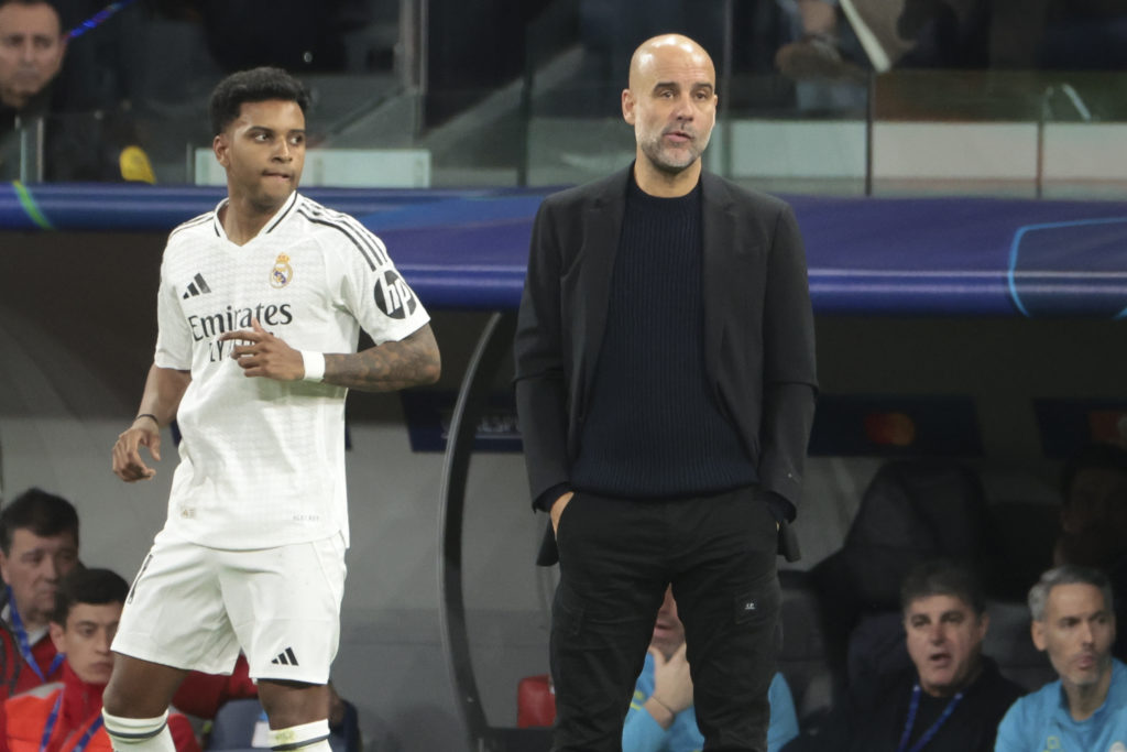 Rodrygo in action for Real Madrid against Manchester City as Pep Guardiola watches on from the touchline