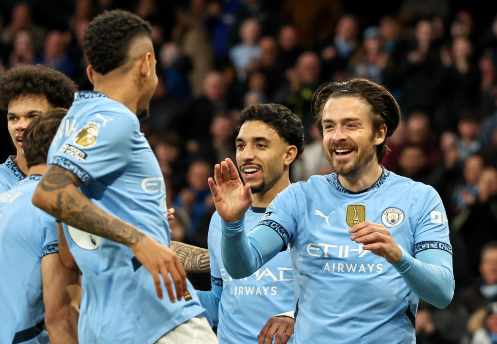Manchester City's Jack Grealish celebrates scoring the opening goal with Savinho and Omar Marmoush during the Premier League match between Manchester City FC and Leicester City FC at Etihad Stadium