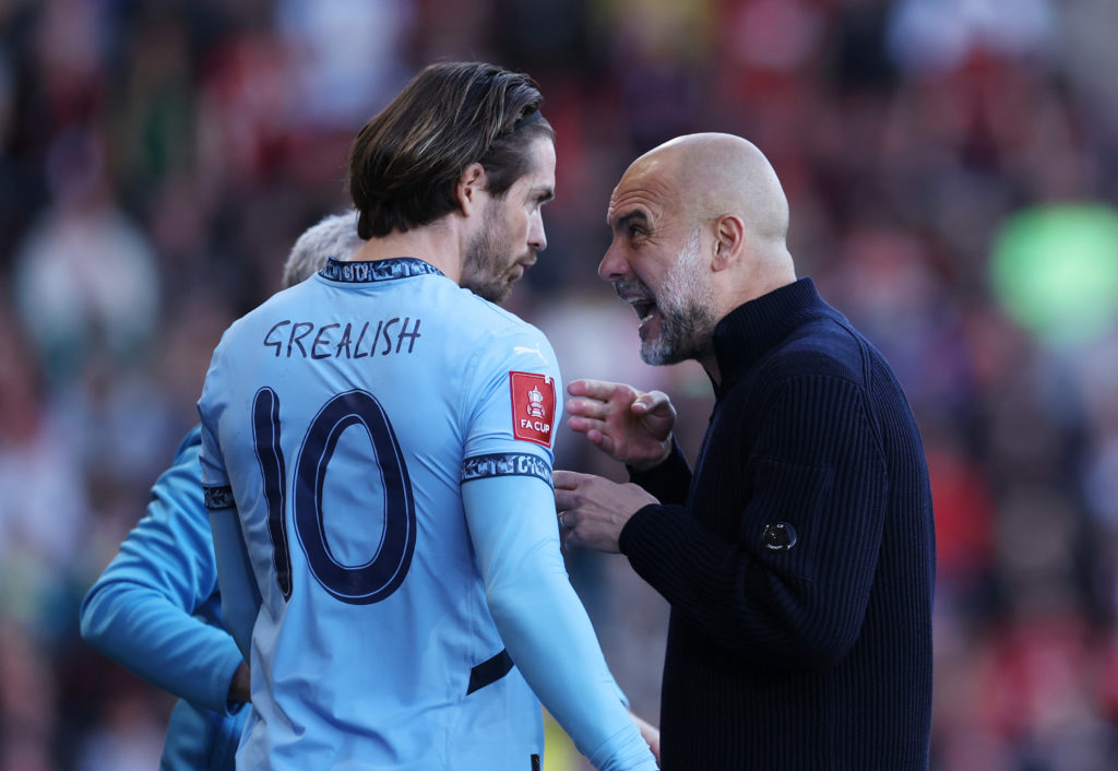 Pep Guardiola Manager / Head Coach of Manchester City with Jack Grealish of Manchester City during the Emirates FA Cup Quarter Final match between AFC Bournemouth and Manchester City