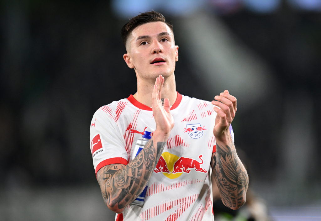 Benjamin Sesko applauding the fans after an RB Leipzig game in the Bundesliga