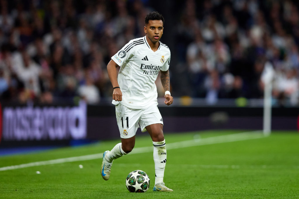 Rodrygo Goes of Real Madrid runs with the ball during the UEFA Champions League 2024/25 Quarter Final Second Leg match between Real Madrid C.F. and Arsenal FC at Estadio Santiago Bernabeu