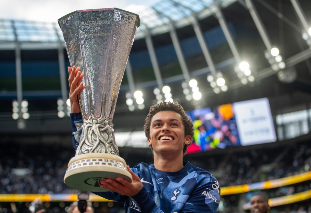 Brennan Johnson holds the Europa League trophy after Tottenham Hotspur FC v Brighton & Hove Albion FC - Premier League