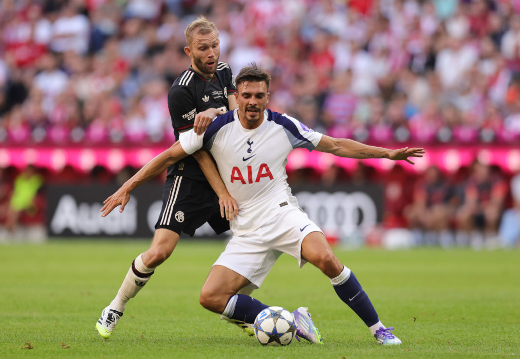 Konrad Laimer of FC Bayern München (L) and Joao Palhinha of Tottenham Hotspur compete for the ball during the pre-season friendly match as part of the Telekom Cup between FC Bayern München and Tottenham Hotspur at Allianz Arena on August 7