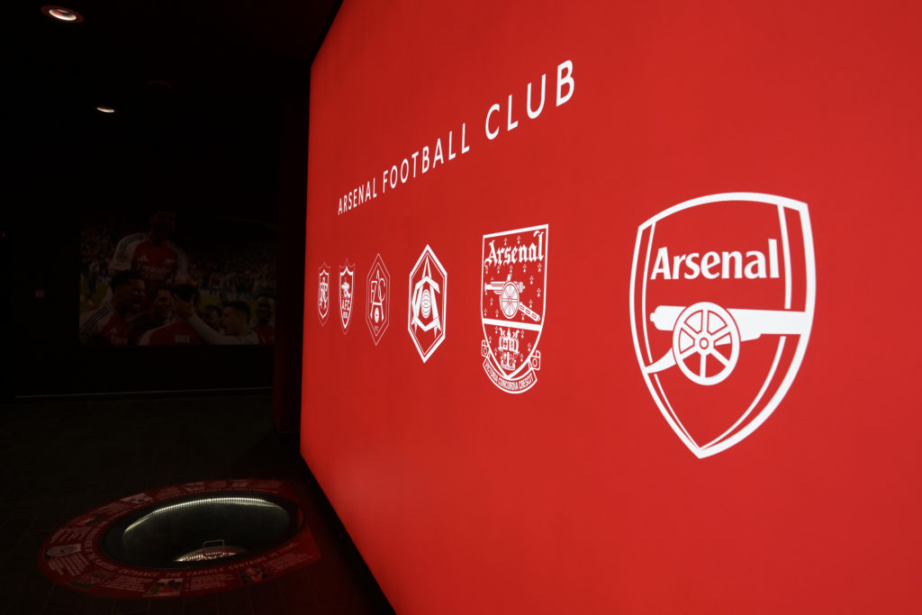 Closeup shot of Arsenal badge on wall outside Emirates Stadium