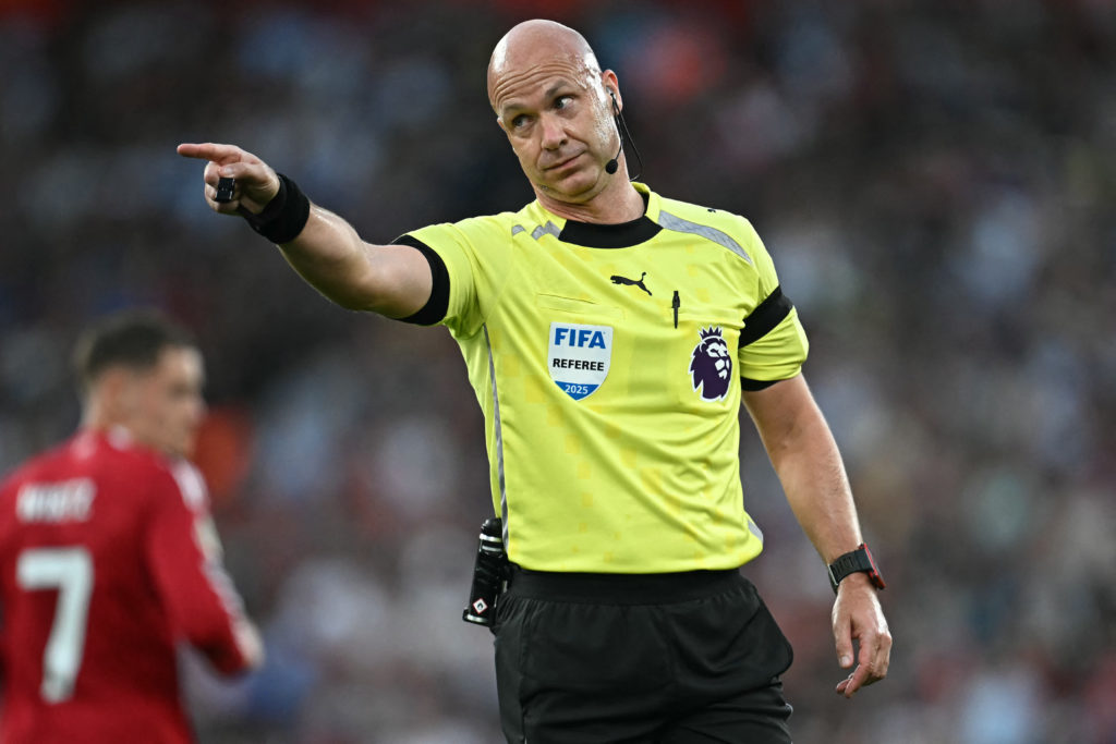 English referee Anthony Taylor gestures during the English Premier League football match between Liverpool and Bournemouth