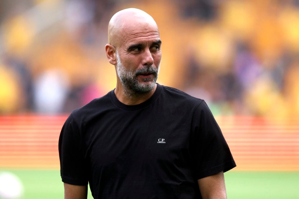Pep Guardiola looks on during Manchester City's Premier League match against Wolves.