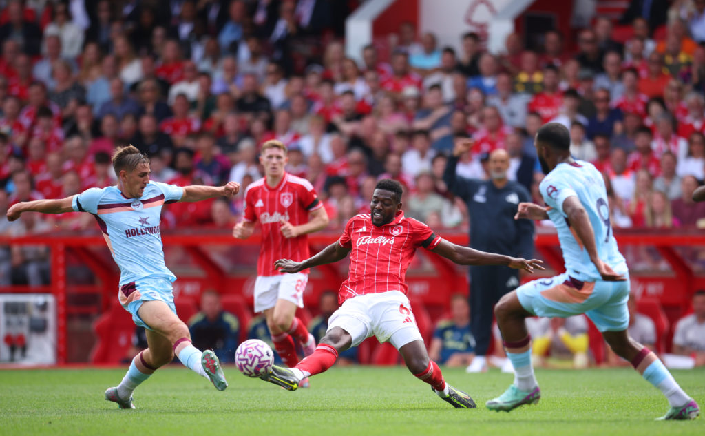 Yehor Yarmolyuk of Brentford and Ibrahim Sangare of Nottingham Forest challenge during the Premier League match between Nottingham Forest and Brentford at City Ground