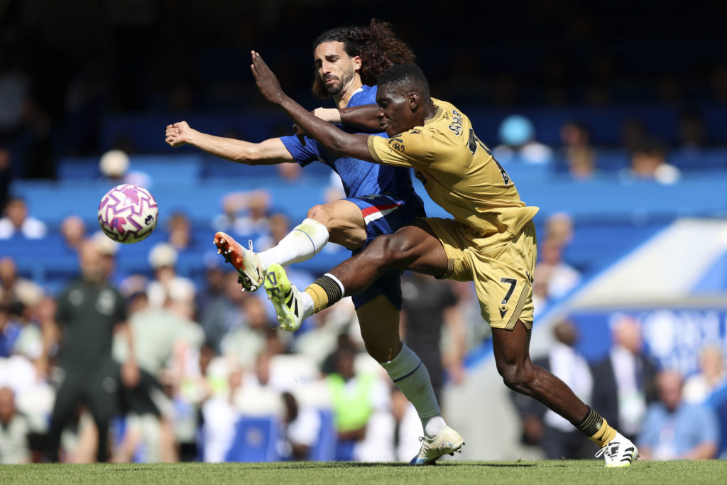 Marc Cucurella of Chelsea and Ismaila Sarr of Crystal Palace challenge