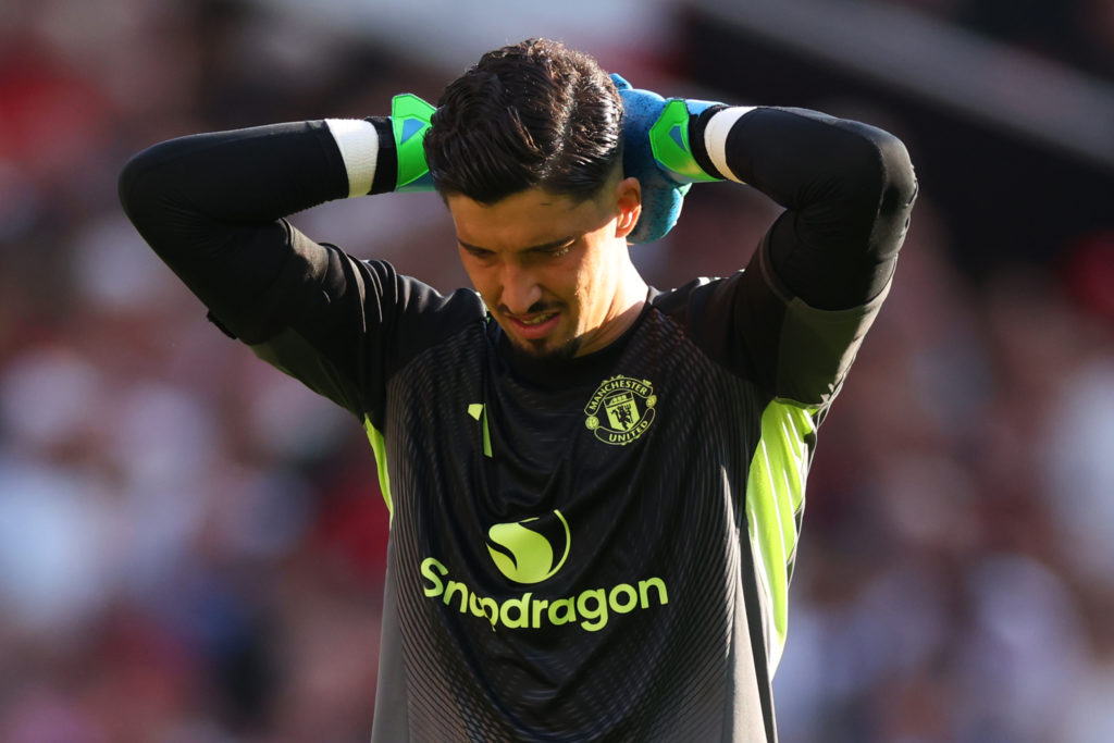 Altay Bayindir looking dejected during a game between Manchester United and Arsenal