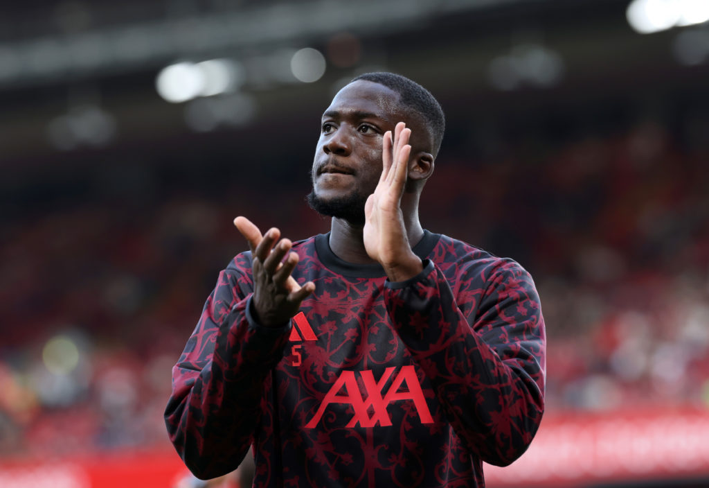 Ibrahima Konate of Liverpool applauds the fans as he warms up prior to the Premier League match between Liverpool and Bournemouth