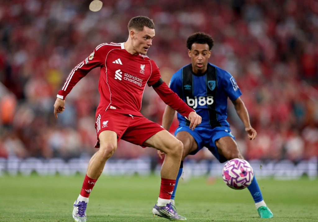 Florian Wirtz of Liverpool controls the ball whilst under pressure from Tyler Adams of AFC Bournemouth during the Premier League match between Liverpool and Bournemouth