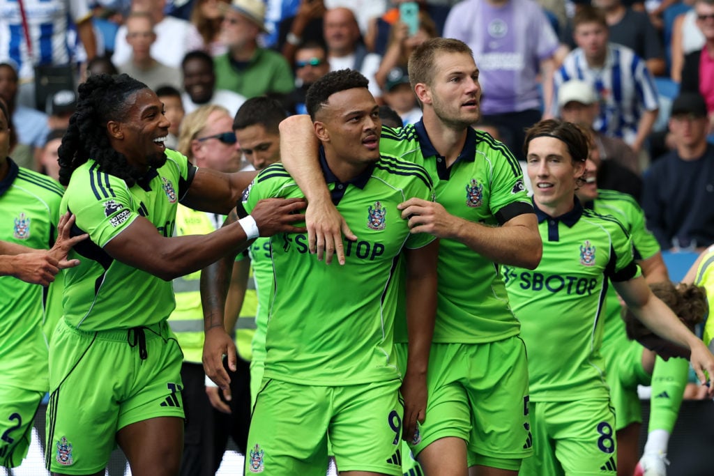 Rodrigo Muniz of Fulham celebrates scoring his team's first goal with teammates Joachim Andersen during the Premier League match between Brighton & Hove Albion and Fulham at Amex Stadium.