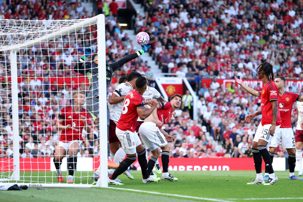 Altay Bayindir of Manchester United fails to save a header which leads to the first goal for Arsenal scored by Riccardo Calafiori of Arsenal during the Premier League match between Manchester United and Arsenal at Old Trafford.