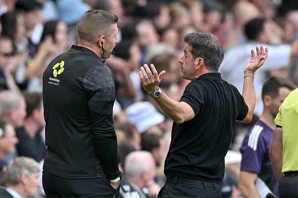 Marco Silva manager of Fulham and Fourth official Rob Jones during the Premier League match between Fulham and Manchester United at Craven Cottage