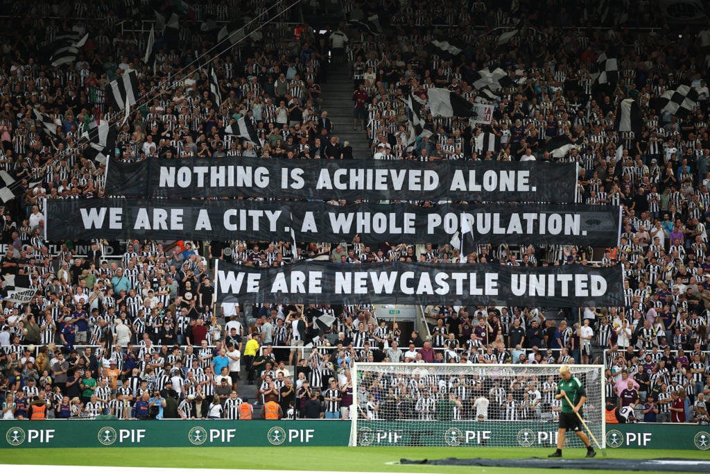Newcastle United fans with banners on the Gallowgate End before the Premier League match between Newcastle United and Liverpool at St James' Park