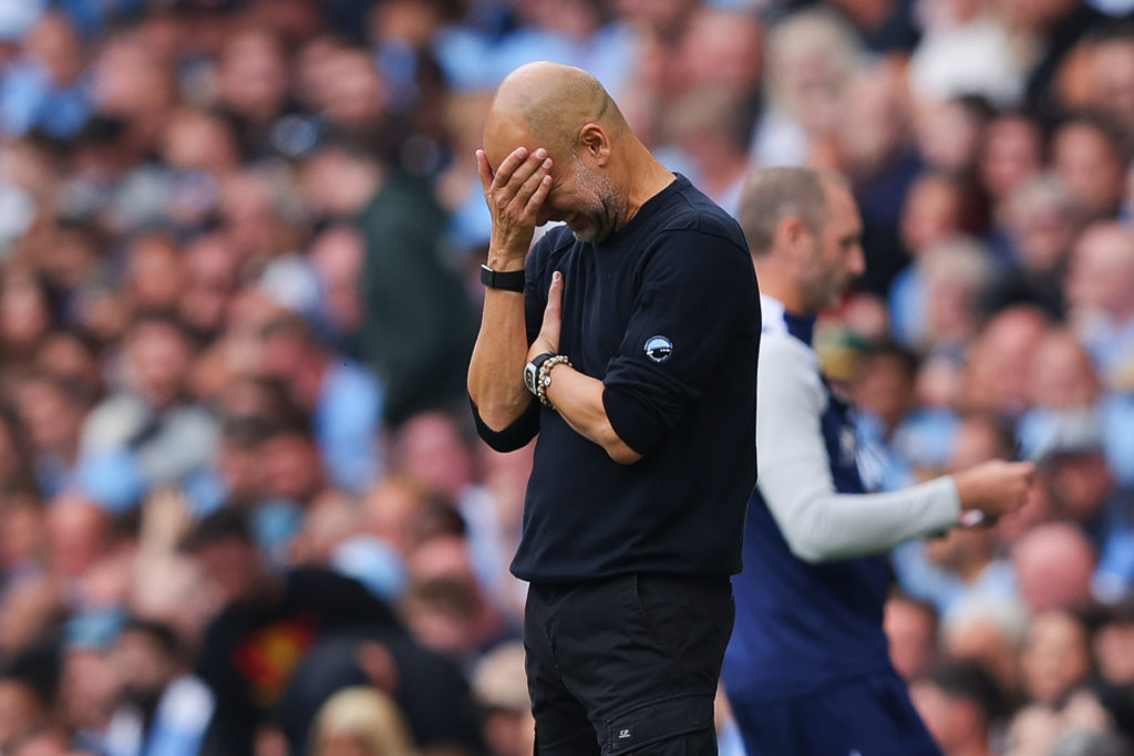 Josep 'Pep' Guardiola, head coach of Manchester City, reacts after a missed chance during the Premier League match between Manchester City and Tottenham Hotspur at Etihad Stadium
