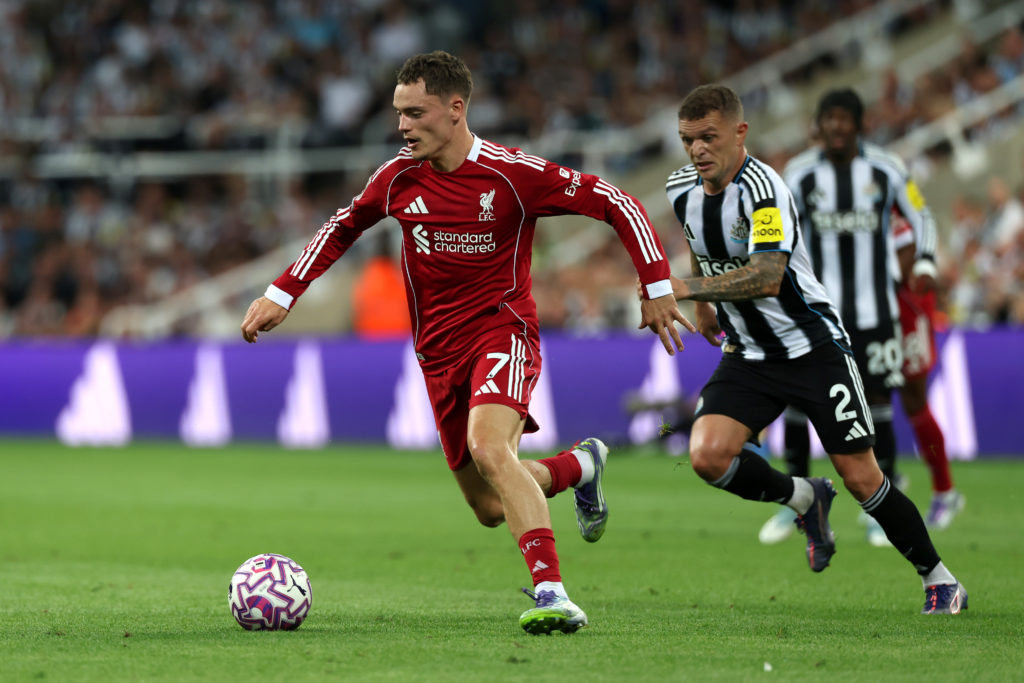Liverpool's Florian Wirtz duels with Newcastle's Kieran Trippier.