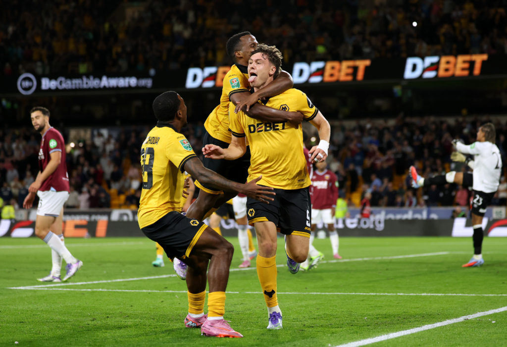 Jorgen Strand Larsen of Wolverhampton Wanderers celebrates scoring his team's third goal with teammates Jackson Tchatchoua and Jhon Arias
