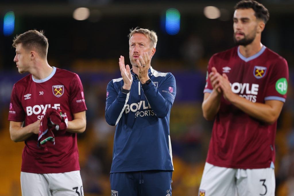 Graham Potter applauds West Ham fans after losing to Wolves.