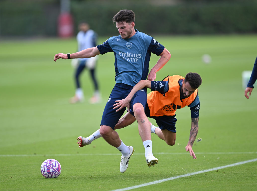 Declan Rice brushes Fabio Vieira aside in training