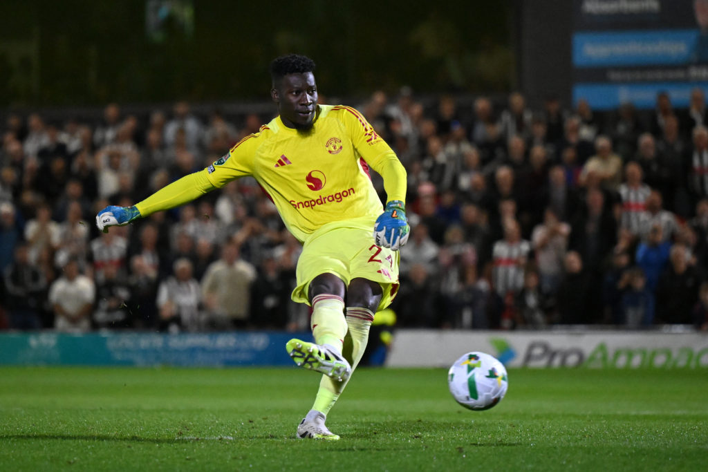 Andre Onana takes a penalty for Manchester United against Grimsby Town