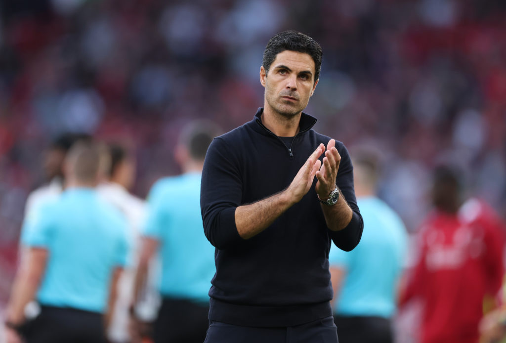 Mikel Arteta, Manager of Arsenal, applauds the fans following the team's defeat during the Premier League match between Liverpool and Arsenal at Anfield.